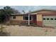 Modest single-story home with mixed brick and painted facade and an attached single-car garage at 2817 Miriam S St, Gulfport, FL 33711