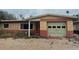 Single-story home featuring a red and tan brick facade with an attached garage at 2817 Miriam S St, Gulfport, FL 33711