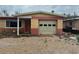 Single-story home featuring a red and tan brick facade with an attached garage at 2817 Miriam S St, Gulfport, FL 33711