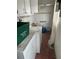 The laundry area features a washer, dryer, and utility sink with room for storage at 2817 Miriam S St, Gulfport, FL 33711