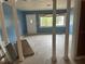 Living room with blue walls, decorative columns, and natural light at 2817 Miriam S St, Gulfport, FL 33711