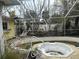 Screened-in pool area featuring a built-in hot tub and mature foliage at 2817 Miriam S St, Gulfport, FL 33711