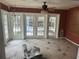 Sunroom boasts tiled floors and multiple sets of glass French doors at 2817 Miriam S St, Gulfport, FL 33711