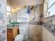 Updated bathroom featuring new vanity, sink, and tiled shower at 3001 Regal Oaks Blvd, Palm Harbor, FL 34684