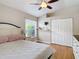 Bedroom with ample closet space, hardwood floors, and natural light at 3001 Regal Oaks Blvd, Palm Harbor, FL 34684