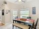 Cozy breakfast nook with seating, natural light, and a view of the pool at 3001 Regal Oaks Blvd, Palm Harbor, FL 34684
