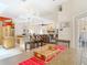 Open floorplan view of the dining area connecting kitchen and living room at 3001 Regal Oaks Blvd, Palm Harbor, FL 34684