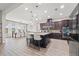 Spacious kitchen with wood floors, a large island, and plenty of natural light at 32122 Wenlock Loop, Wesley Chapel, FL 33543