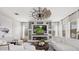 Bright living room featuring a custom entertainment center and cozy fireplace at 32122 Wenlock Loop, Wesley Chapel, FL 33543