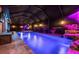 Stunning enclosed pool with a waterfall feature and lush landscaping for a private oasis at 32122 Wenlock Loop, Wesley Chapel, FL 33543