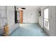 Unfinished basement with white walls, painted floor, and utility access at 3243 Eisenhower Dr, Holiday, FL 34691