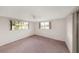 Bedroom with window and carpet at 3243 Eisenhower Dr, Holiday, FL 34691
