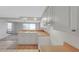 Well-lit kitchen with a breakfast bar and clear view into the living area at 3243 Eisenhower Dr, Holiday, FL 34691