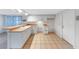 The kitchen offers ample counter space and tile flooring at 3243 Eisenhower Dr, Holiday, FL 34691