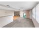 Spacious living room with carpet, ceiling fans, and sliding doors to an enclosed lanai at 3243 Eisenhower Dr, Holiday, FL 34691