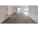 Bright, open-concept living room perfect for entertaining guests or relaxing with Gathering at 3243 Eisenhower Dr, Holiday, FL 34691