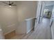 Bright hallway with light hardwood floors leading to additional rooms in the home at 330 Lang N Ct # 1, St Petersburg, FL 33701