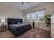 Inviting main bedroom with a comfortable bed, stylish rug, and natural light from the windows at 330 Lang N Ct # 1, St Petersburg, FL 33701