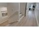 View of a modern staircase with hardwood floors and a handrail to the upper level at 330 Lang N Ct # 1, St Petersburg, FL 33701