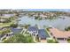 Waterfront home features lush landscaping, a private dock, and quick access to open bay waters at 330 Palm Ne Is, Clearwater Beach, FL 33767