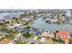 Waterfront properties with boat access feature pools and lush landscaping amid a vibrant coastal neighborhood at 330 Palm Ne Is, Clearwater Beach, FL 33767