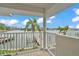 Balcony view featuring a waterfront view with a personal boat dock and beautiful landscaping at 330 Palm Ne Is, Clearwater Beach, FL 33767