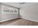 Bright bedroom with a large window offering natural light and a view of the outside at 330 Palm Ne Is, Clearwater Beach, FL 33767