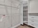 Spacious walk-in closet with built-in shelving and drawers, providing ample storage space at 330 Palm Ne Is, Clearwater Beach, FL 33767