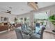 Open-concept dining room offering natural light, modern chandelier, and view of the living space at 330 Palm Ne Is, Clearwater Beach, FL 33767