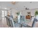 Spacious dining room featuring hardwood floors and views of the living room and staircase at 330 Palm Ne Is, Clearwater Beach, FL 33767