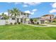Two-story home boasting a manicured lawn, lush landscaping, and a convenient two-car garage at 330 Palm Ne Is, Clearwater Beach, FL 33767