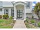 Inviting home entrance featuring a pathway, stone landscaping, and a stylish front door at 330 Palm Ne Is, Clearwater Beach, FL 33767