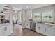 Eat-in kitchen features modern cabinets and appliances, with views of the waterfront at 330 Palm Ne Is, Clearwater Beach, FL 33767