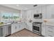 Modern kitchen with stainless appliances, and a view of the water at 330 Palm Ne Is, Clearwater Beach, FL 33767