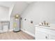 Well-lit laundry room with a sink, water heater, and ample space for storage or other appliances at 330 Palm Ne Is, Clearwater Beach, FL 33767