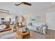 Bright living room featuring hardwood floors, a modern ceiling fan, and comfortable seating at 330 Palm Ne Is, Clearwater Beach, FL 33767