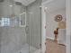 Walk-in shower featuring stylish tile, glass door and modern fixtures at 330 Palm Ne Is, Clearwater Beach, FL 33767