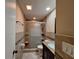 Bathroom complete with tiled shower, glass door, modern fixtures, and neutral color palette at 3357 Hunt Club Dr, Clearwater, FL 33761