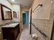 Bathroom features a granite countertop, dark wood vanity, and decorative tile backsplash at 3357 Hunt Club Dr, Clearwater, FL 33761