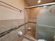 Bathroom complete with tiled shower, glass door, modern fixtures, and neutral color palette at 3357 Hunt Club Dr, Clearwater, FL 33761