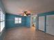 Spacious bedroom featuring tile flooring, ceiling fan, and ensuite bathroom at 3357 Hunt Club Dr, Clearwater, FL 33761