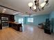 Open kitchen and living area with stainless steel appliances and lots of sunlight at 3357 Hunt Club Dr, Clearwater, FL 33761