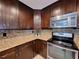 A sleek kitchen featuring stainless steel appliances, granite countertops, and abundant storage at 3357 Hunt Club Dr, Clearwater, FL 33761