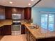 Modern kitchen with stainless steel appliances, and granite countertops at 3357 Hunt Club Dr, Clearwater, FL 33761