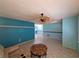Bright living room with tile floors, ceiling fan, and open floor plan at 3357 Hunt Club Dr, Clearwater, FL 33761