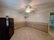 Multi-purpose room is ready for your personalization with tile floors and ceiling fan at 3357 Hunt Club Dr, Clearwater, FL 33761