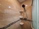 Tiled shower stall has a rainfall shower head and built in corner shelves at 3357 Hunt Club Dr, Clearwater, FL 33761