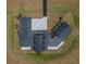 An overhead shot shows a sprawling modern farmhouse with connecting units, black roof, white siding, and manicured landscaping at 3515 Powerline Rd, Lithia, FL 33547