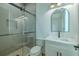 Modern bathroom features glass enclosed shower, sleek vanity, and stylish lighting at 3515 Powerline Rd, Lithia, FL 33547