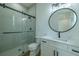 Modern bathroom features glass enclosed shower, sleek vanity, and elegant fixtures at 3515 Powerline Rd, Lithia, FL 33547